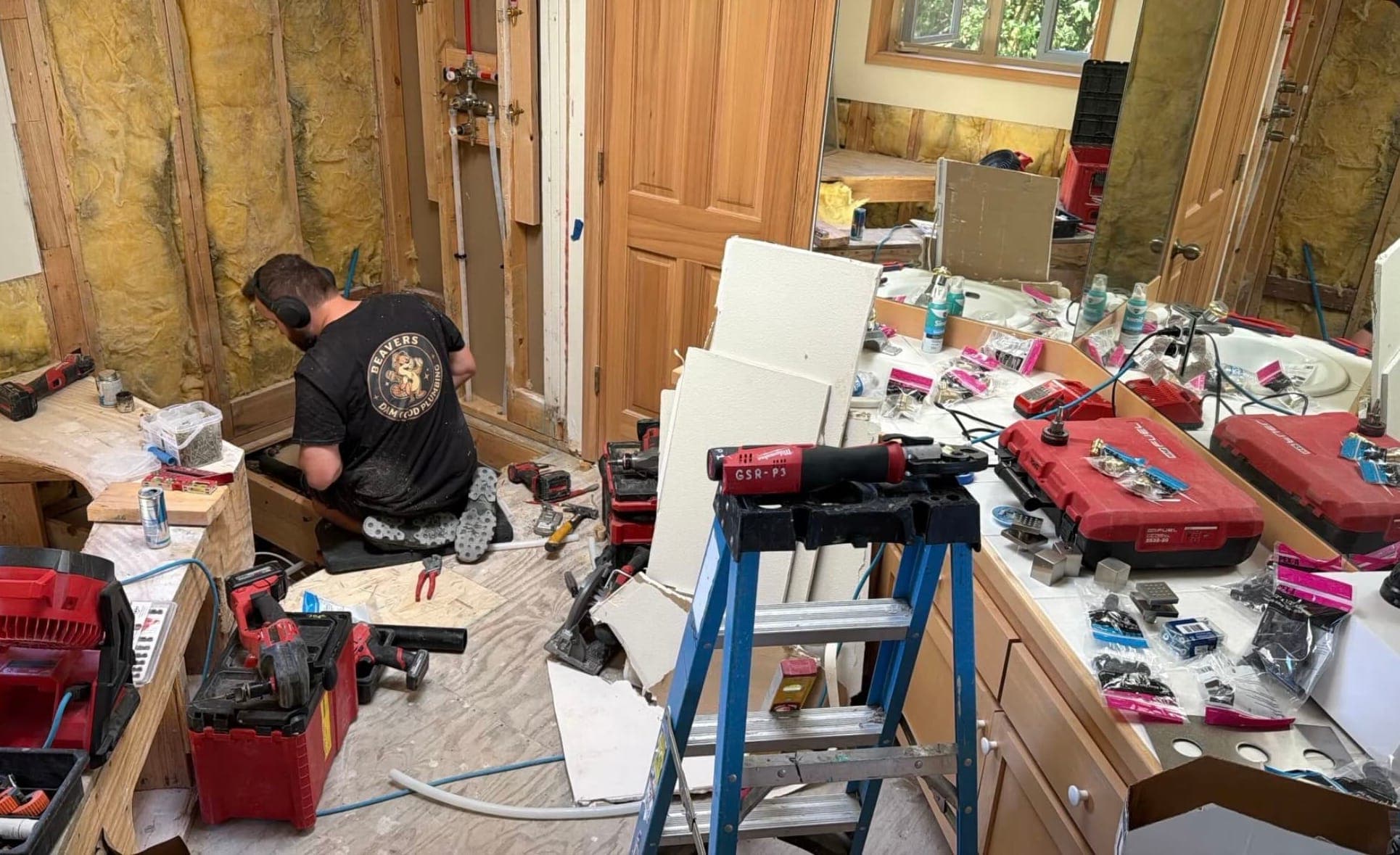 A Beaver's Plumbing plumber roughing in new plumbing during a whole-home remodel